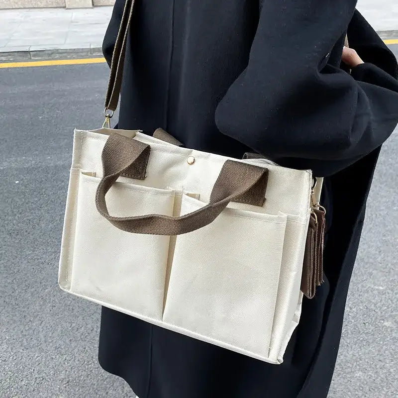 a woman carrying a white bag on the street