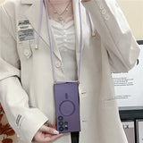 a woman in a white coat holding a purple cell