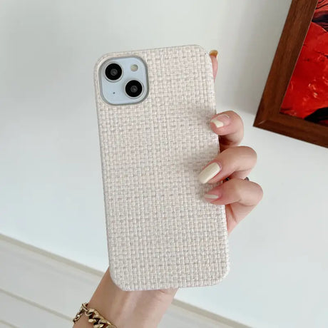 A woman holding a white iphone case