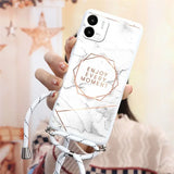a woman holding a white marble phone case