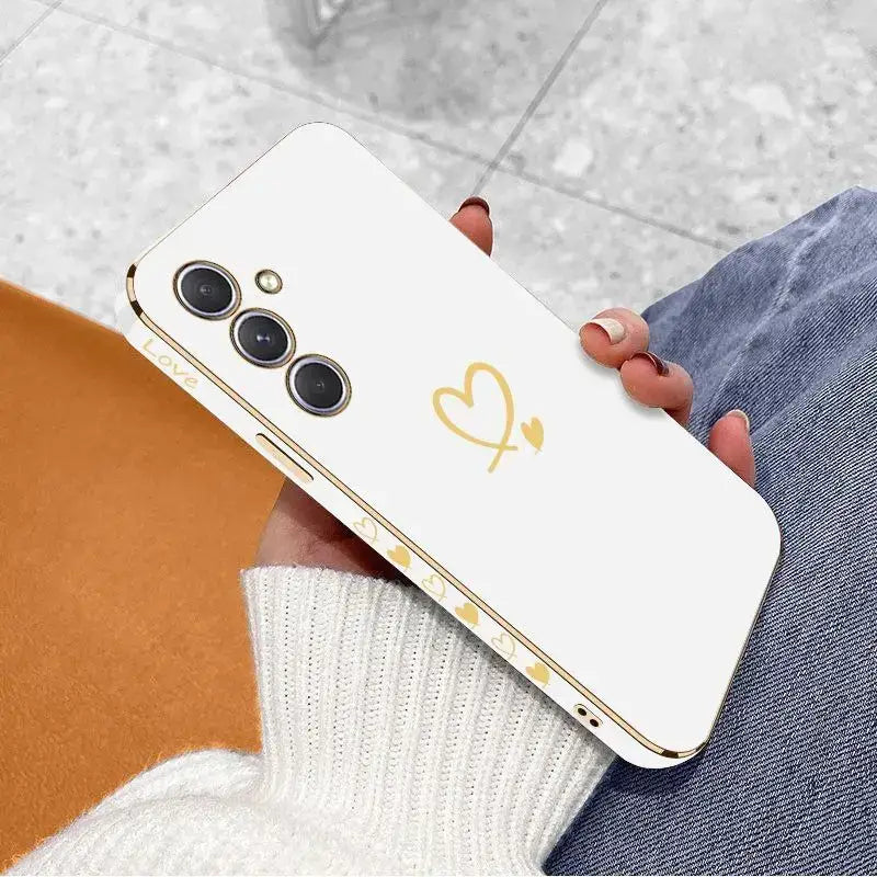 a woman holding a white phone with a heart on it