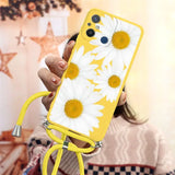 a woman holding a yellow phone case with white flowers on it