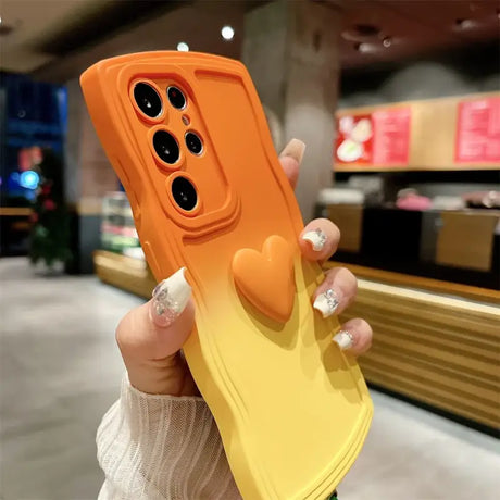 A woman holding a yellow phone case