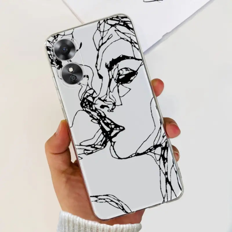 a woman’s face is drawn on a white phone case
