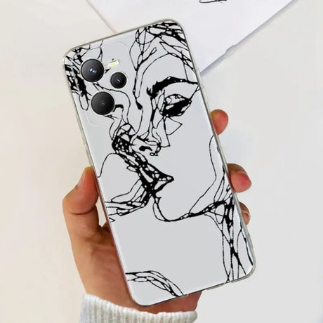 a woman’s face is drawn on a white phone case