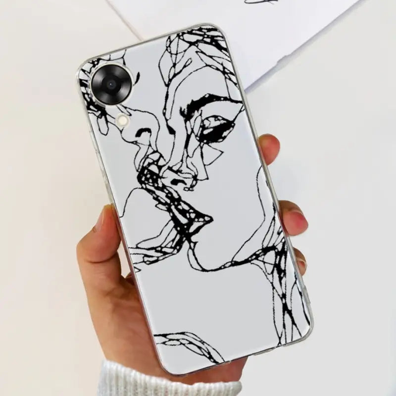 a woman’s face is drawn on a white phone case