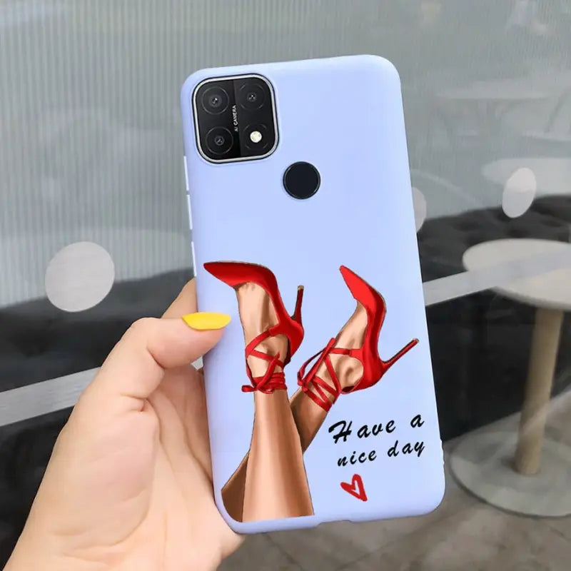 a woman’s hand holding a phone case with a red high heel shoe
