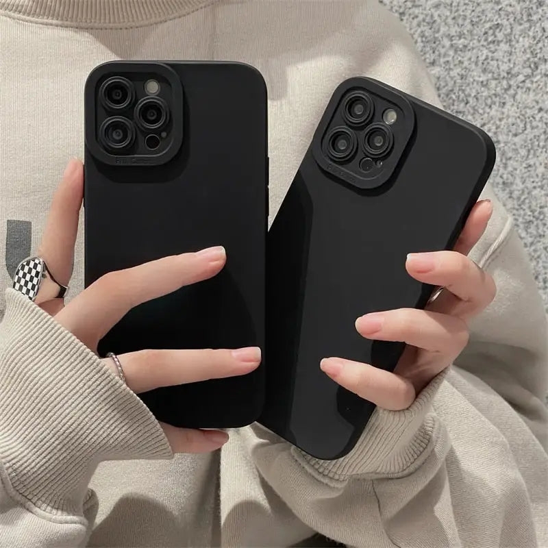 two women holding their iphone cases