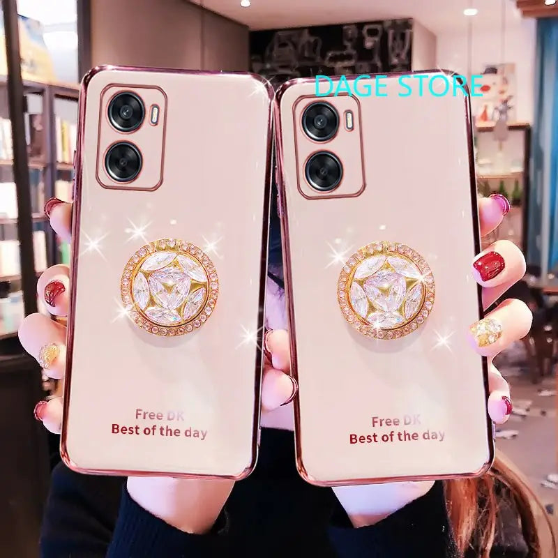 two women holding up their iphone cases with the same logo