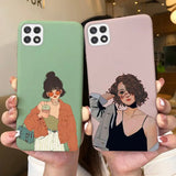 two women holding up their phone cases