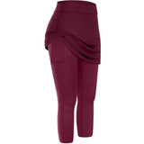 a woman wearing a maroon leggings with a high waist