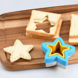 A wooden cutting board with a star shaped cookie cutter