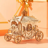 a wooden carriage with a gold ribbon and a bow