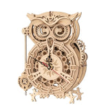 a wooden clock with an owl face on it