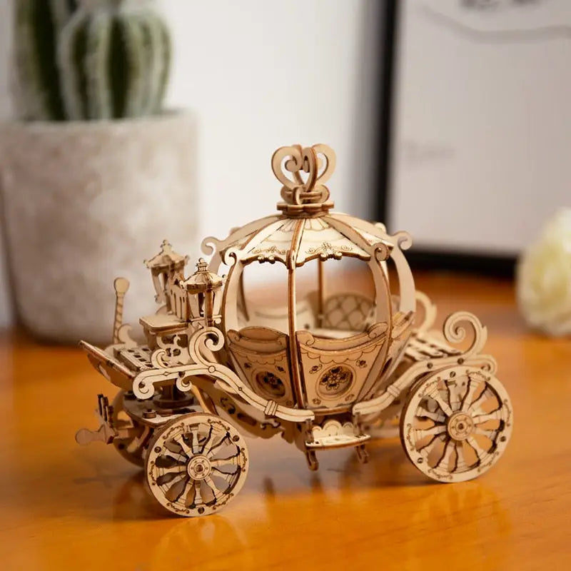 a wooden model of a horse drawn carriage