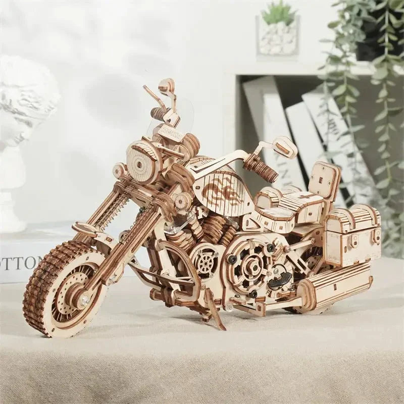 a wooden motorcycle model on a table