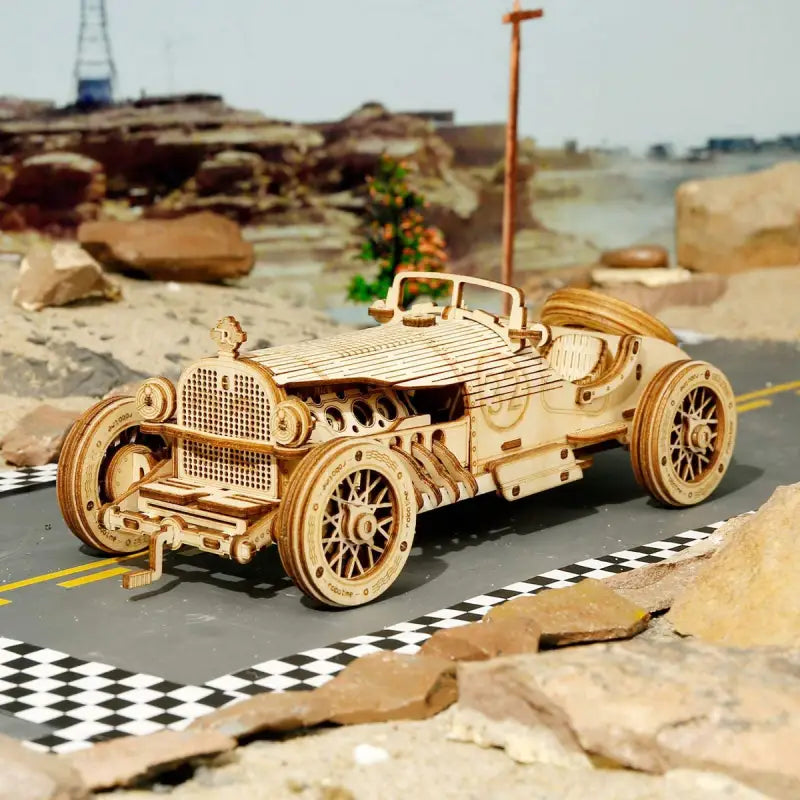 a wooden model of a car on a road