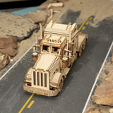 a wooden model of a semi truck on a road