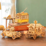 a wooden model of a train and a car