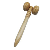 there is a wooden mallet with two wooden balls on it