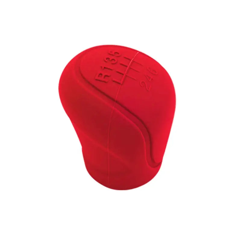 a close up of a red car shift knob with a white background