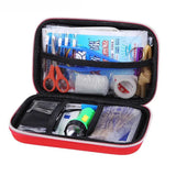a red travel bag filled with various items