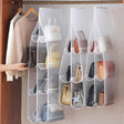 a white hanging organizer with multiple pockets and pockets