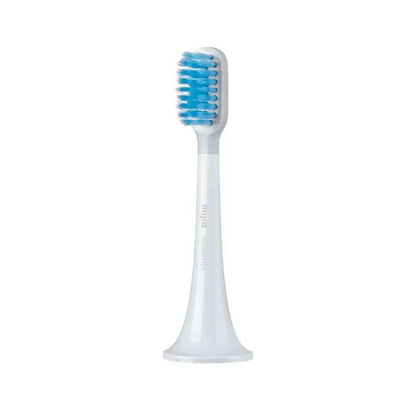 a white toothbrush with blue bre