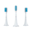 three toothbrushs with blue and white brushes