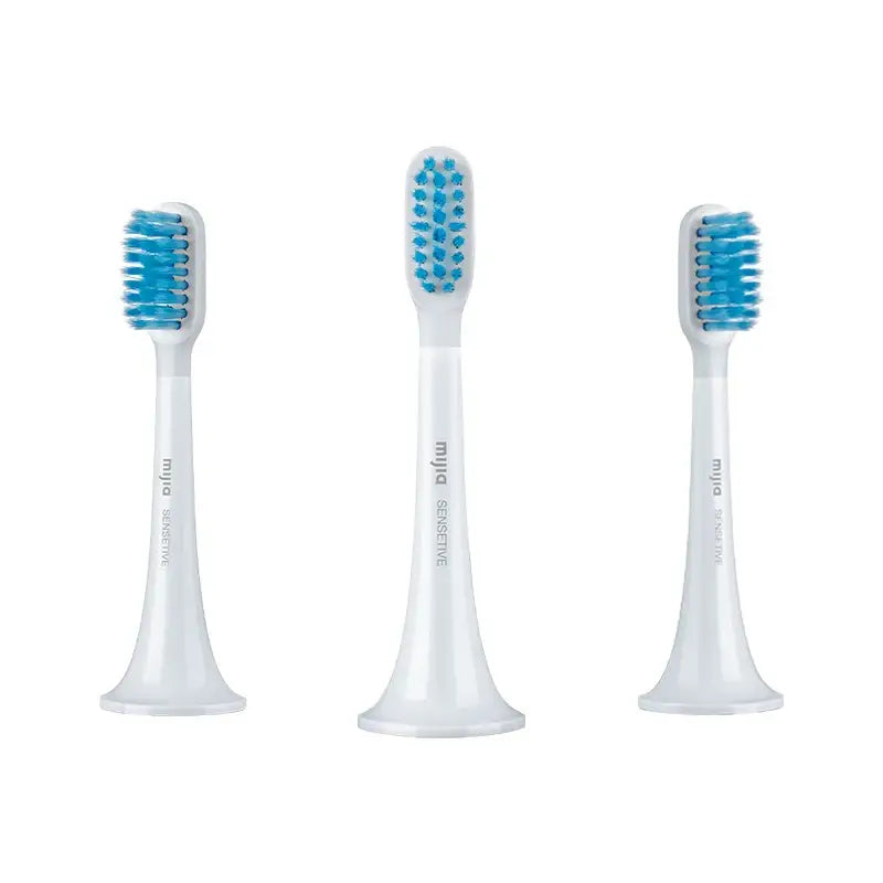 three toothbrushs with blue and white brushes