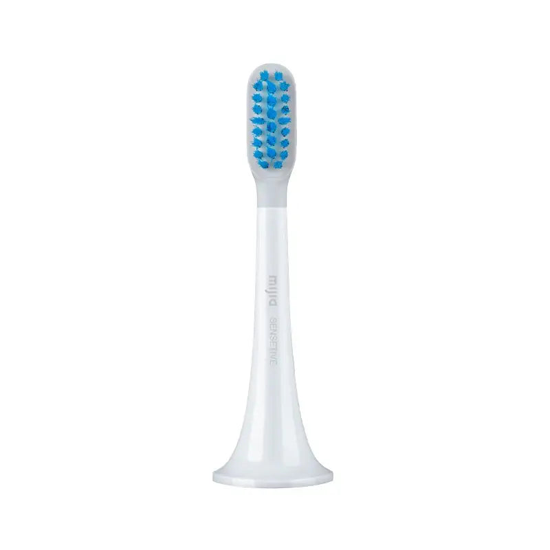 a white toothbrush with blue and white teeth
