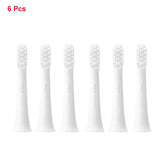 four white toothbrushes with white bristles on a white background