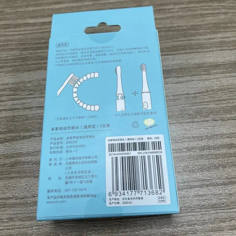 a package of toothbrushs on a table