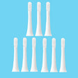 six white toothbrushes with white bristles on a white background