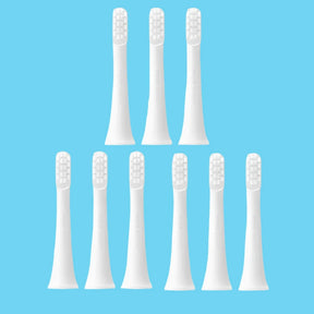 six white toothbrushes with white bristles on a white background