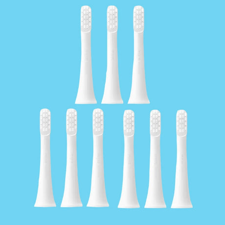 six white toothbrushes with white bristles on a white background