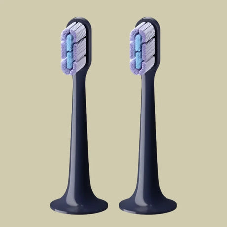 two toothbrushs with blue and white toothbrushs