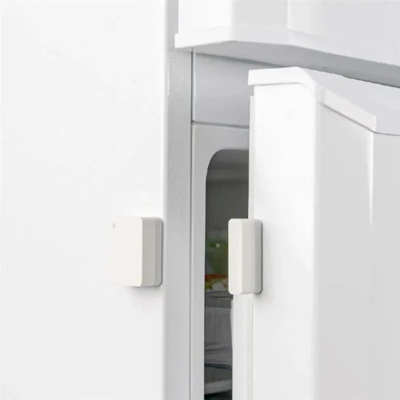 a white refrigerator with a door open