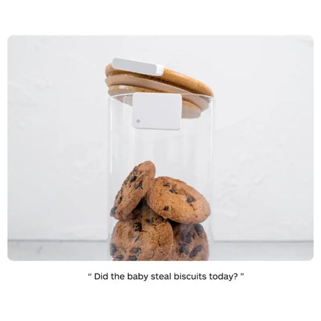 a cookie in a glass jar with a cookie inside