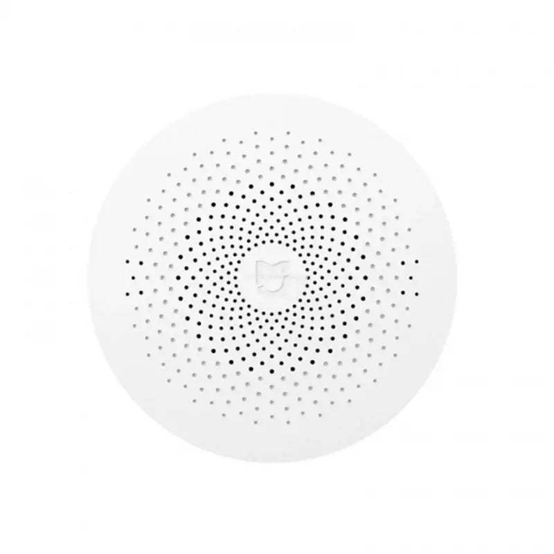 the white speaker with black dots on it