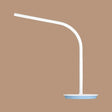 the led desk lamp is a white, with a blue base