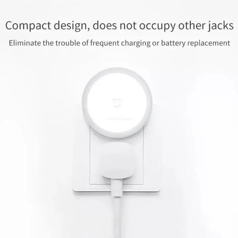 a white clock on a wall with the words compact design does not other jacks