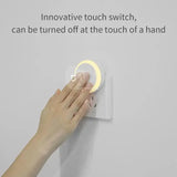 a person is touching a light switch on a wall