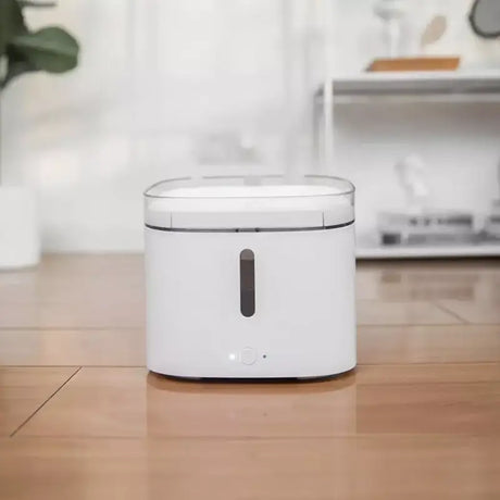 a white air puer sitting on a wooden table