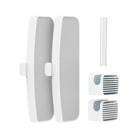 a close up of a pair of white speakers and a white cord