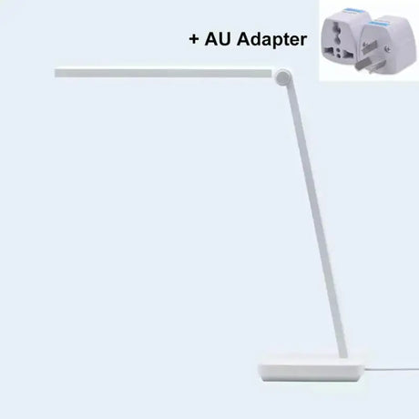 a close up of a white lamp with a plug attached to it