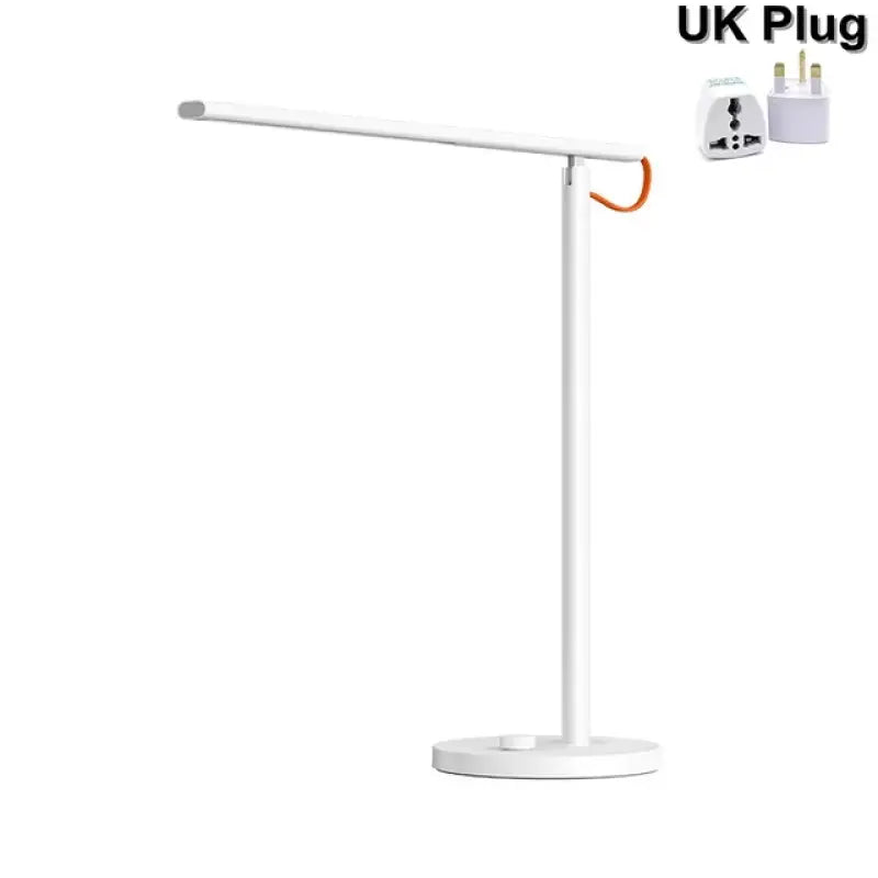 the lamp is white and has a white base with an orange cord