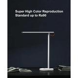 the led desk lamp with a white base and a red cord cord