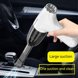someone is using a handheld vacuum cleaner to clean the interior of a car
