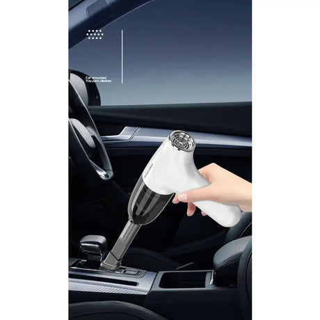 a hand holding a car air fresher